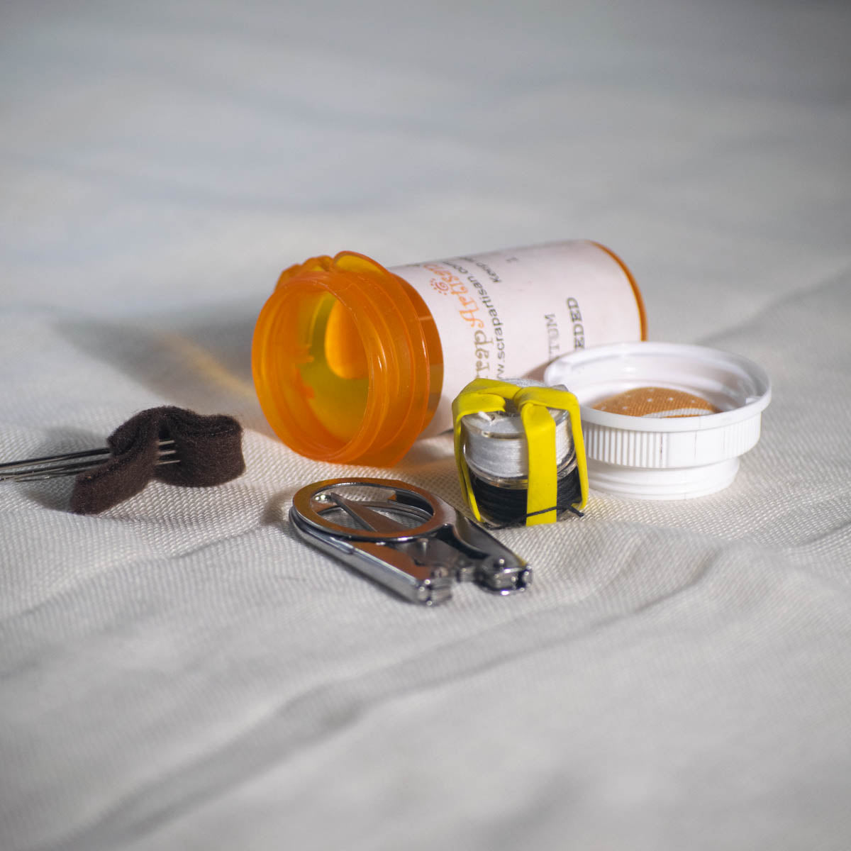 Upcycled Prescription Bottle Sewing Kit — Prescription Label, open with contents