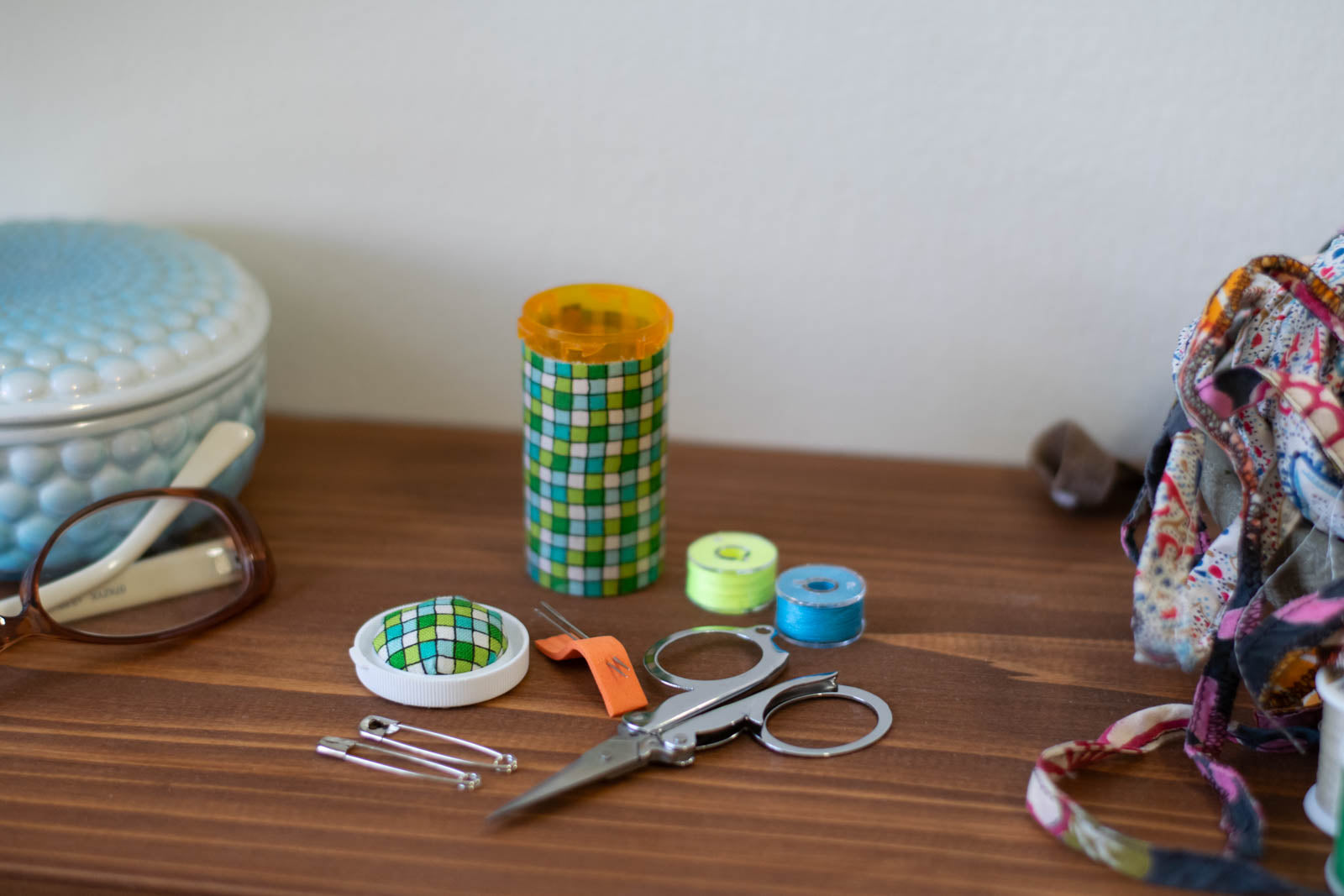 upcycled prescription bottle sewing kit — green tiles, 2.75" high, easy open lid, open with contents