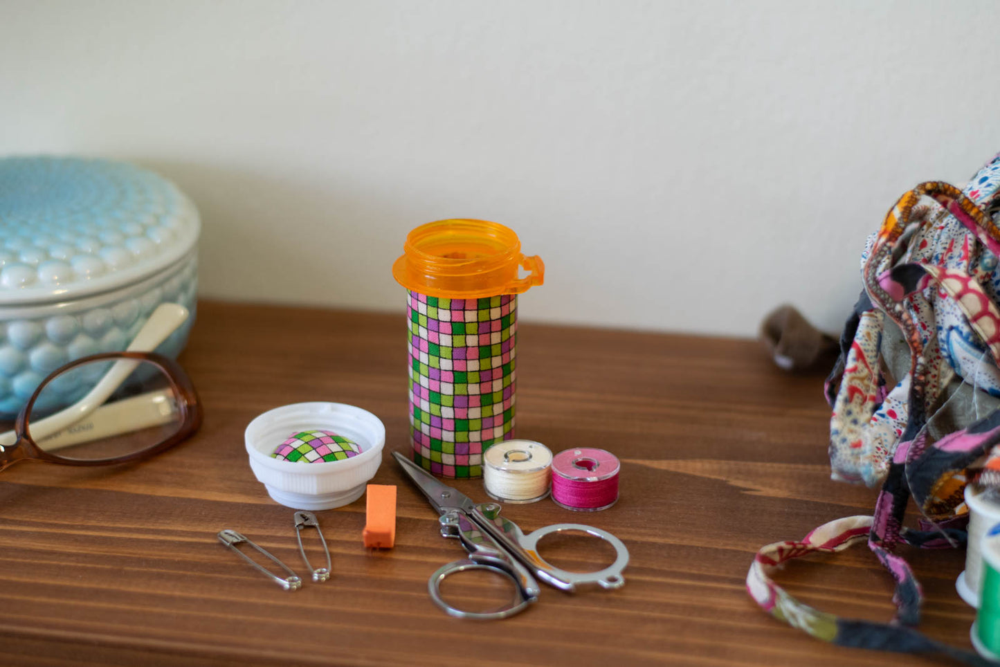 Upcycled Prescription Bottle Sewing Kit — Pink and Green Tiles, 1.75" diameter, open with contents