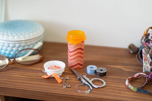 Upcycled Prescription Bottle Sewing Kit — Red and Orange Chevron with Dots on Pink, 3.25" high, open with contents