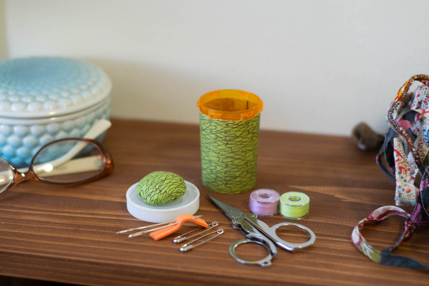Upcycled Prescription Bottle Sewing Kit — Brown Scribbles on Green, 2.75" high, child proof cap, open with contents