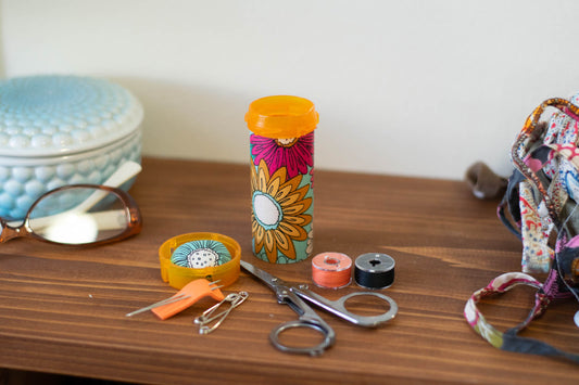Upcycled Prescription Bottle Sewing Kit — Pink, Ochre and White Flowers on Light Blue, 3.5" high, open with contents