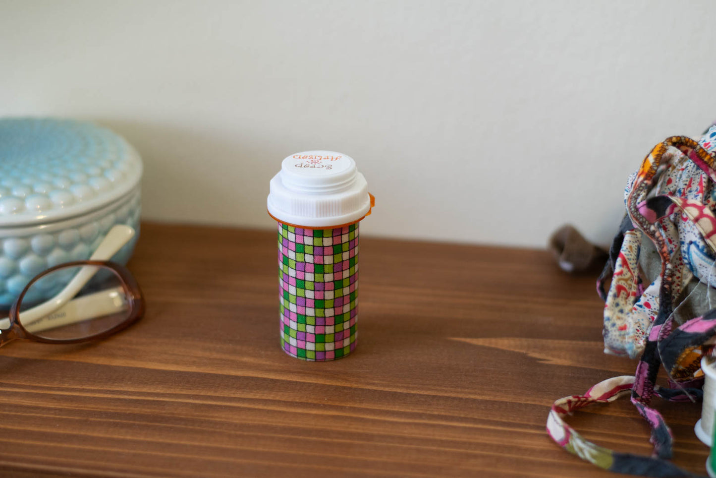 Upcycled Prescription Bottle Sewing Kit — Pink and Green Tiles, 1.75" diameter, closed