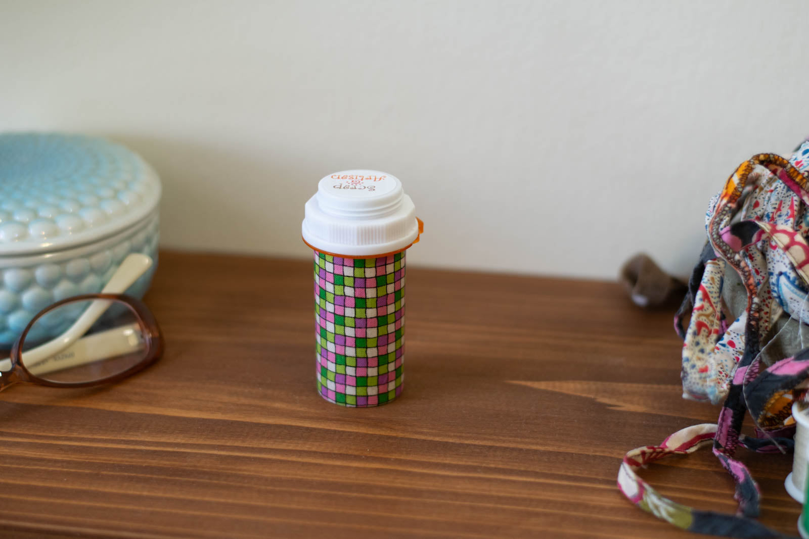 Upcycled Prescription Bottle Sewing Kit — Pink and Green Tiles, 1.75" diameter, closed