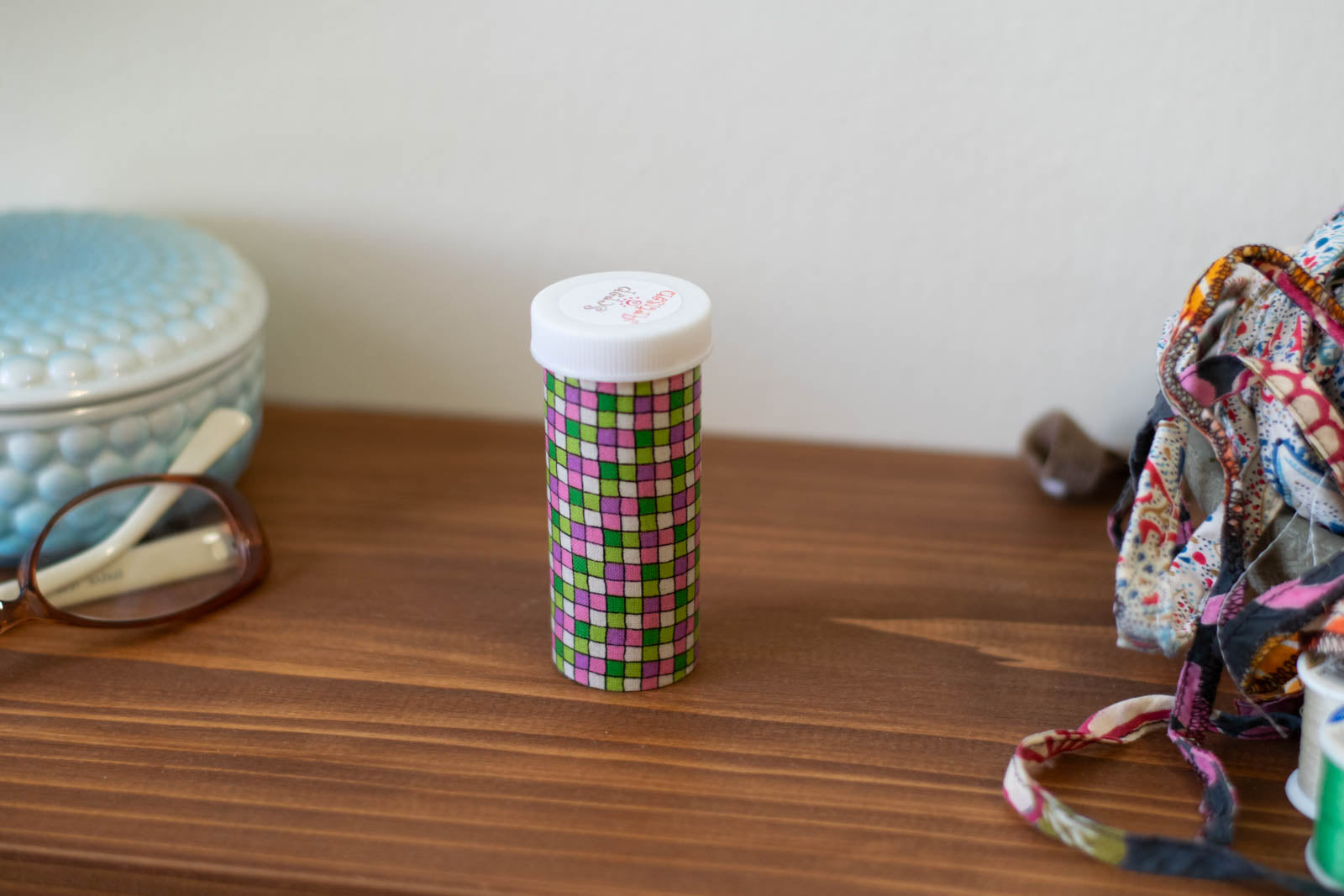 Upcycled Prescription Bottle Sewing Kit — Pink and Green Tiles, 1.5" diameter, closed
