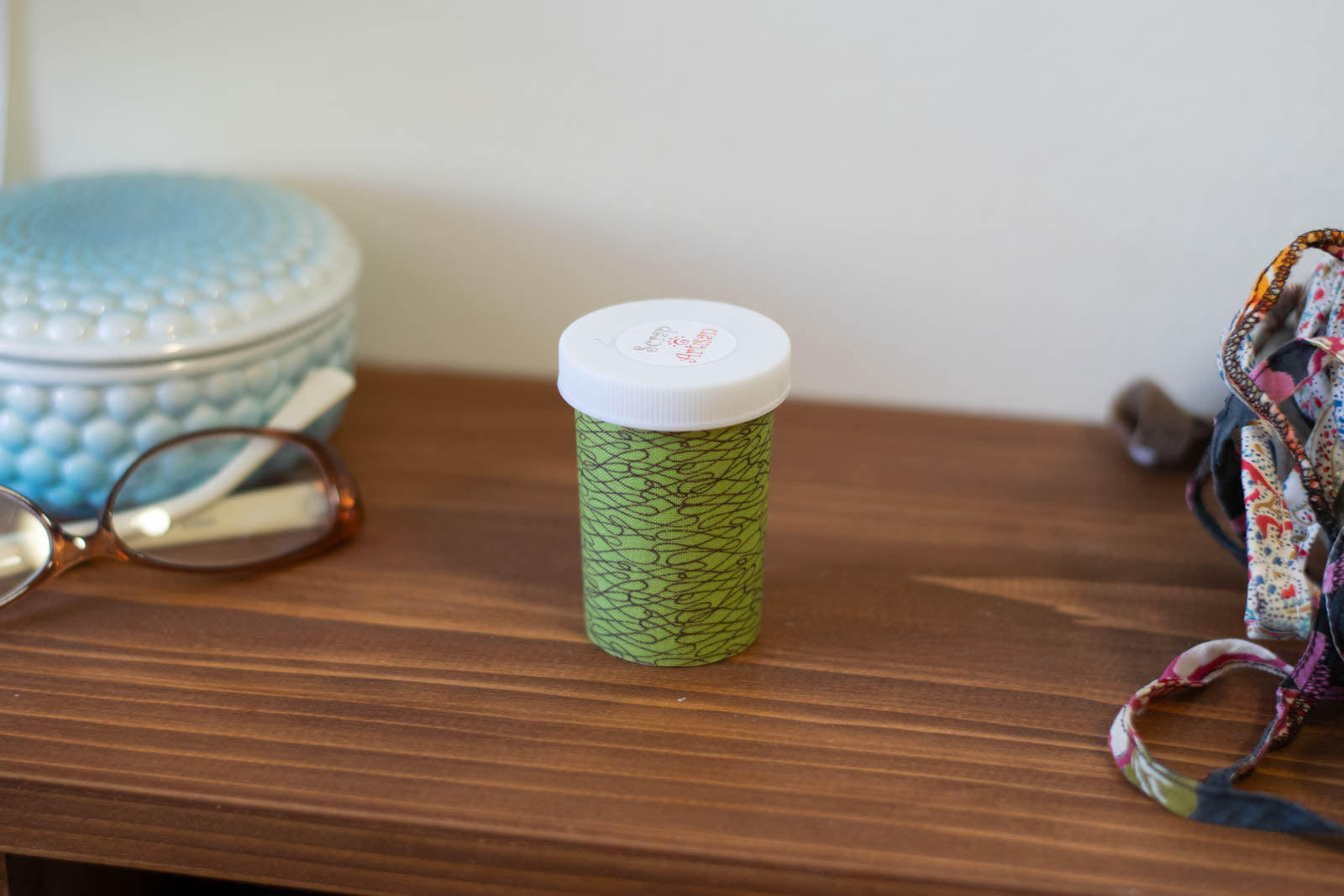 Upcycled Prescription Bottle Sewing Kit — Brown Scribbles on Green, 2.75" high, child proof cap, closed