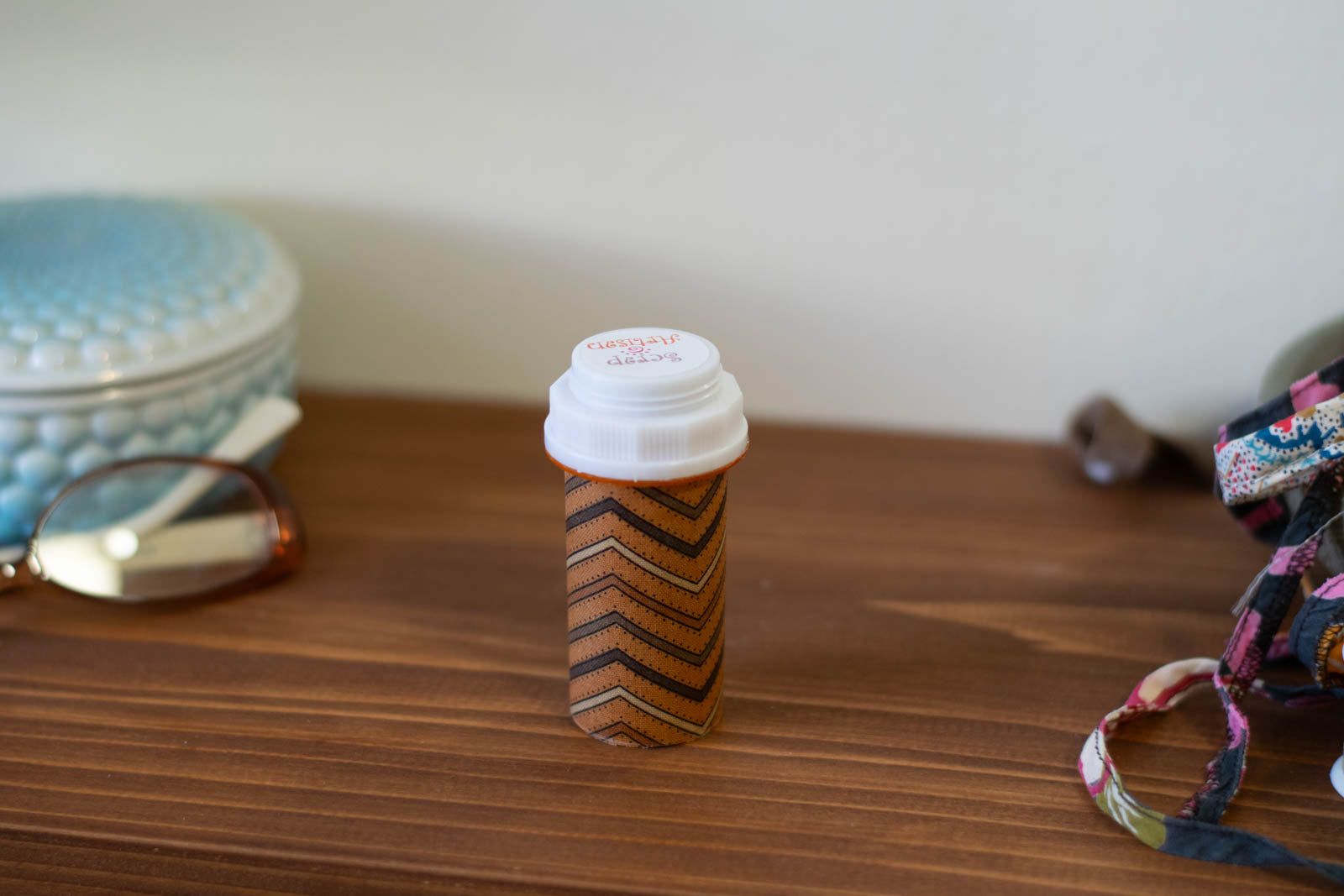 upcycled prescription bottle sewing kit — brown chevron pattern with dots, closed, 3.25" high