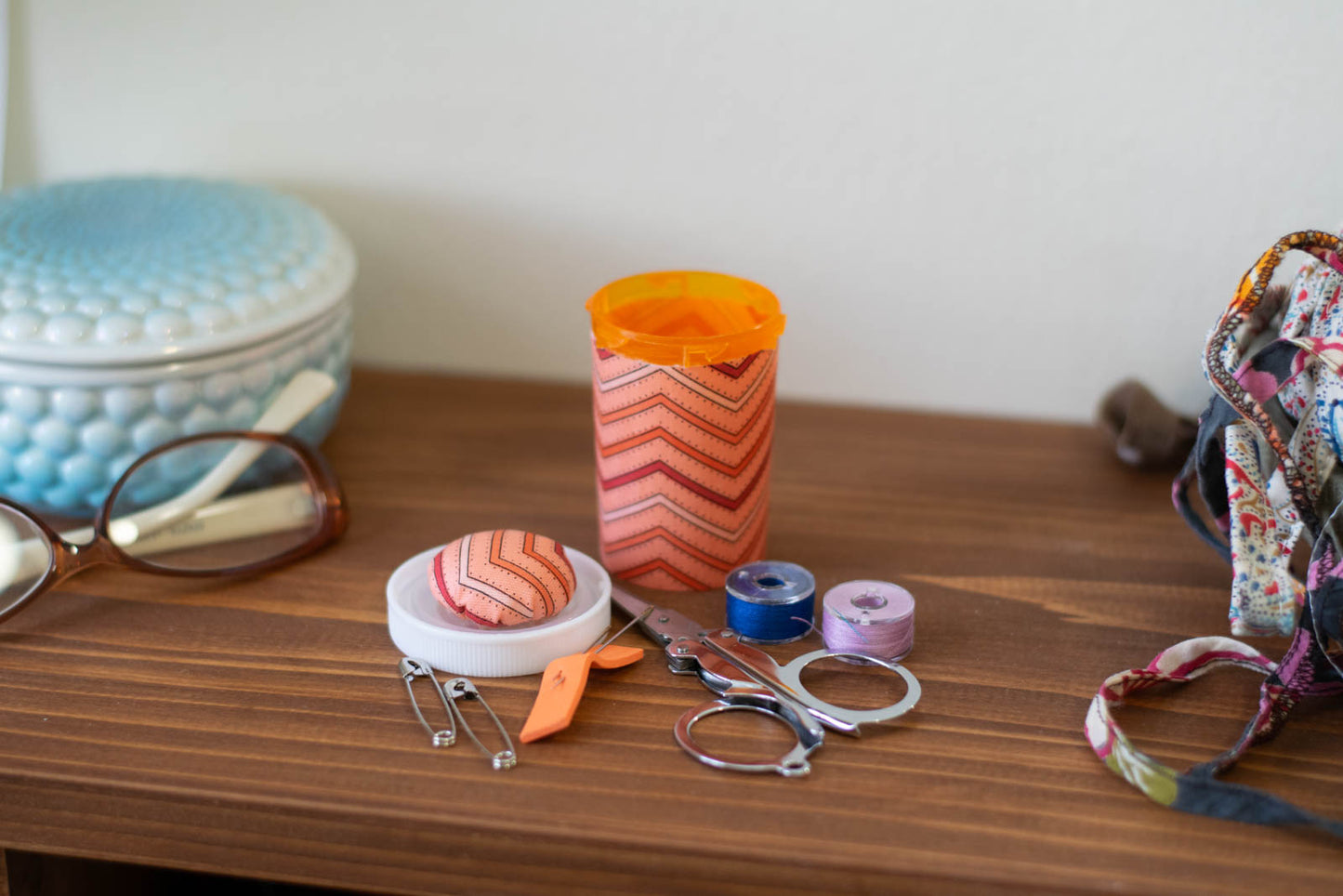 Upcycled Prescription Bottle Sewing Kit — Red and Orange Chevron with Dots on Pink, 2.75" high, open with contents