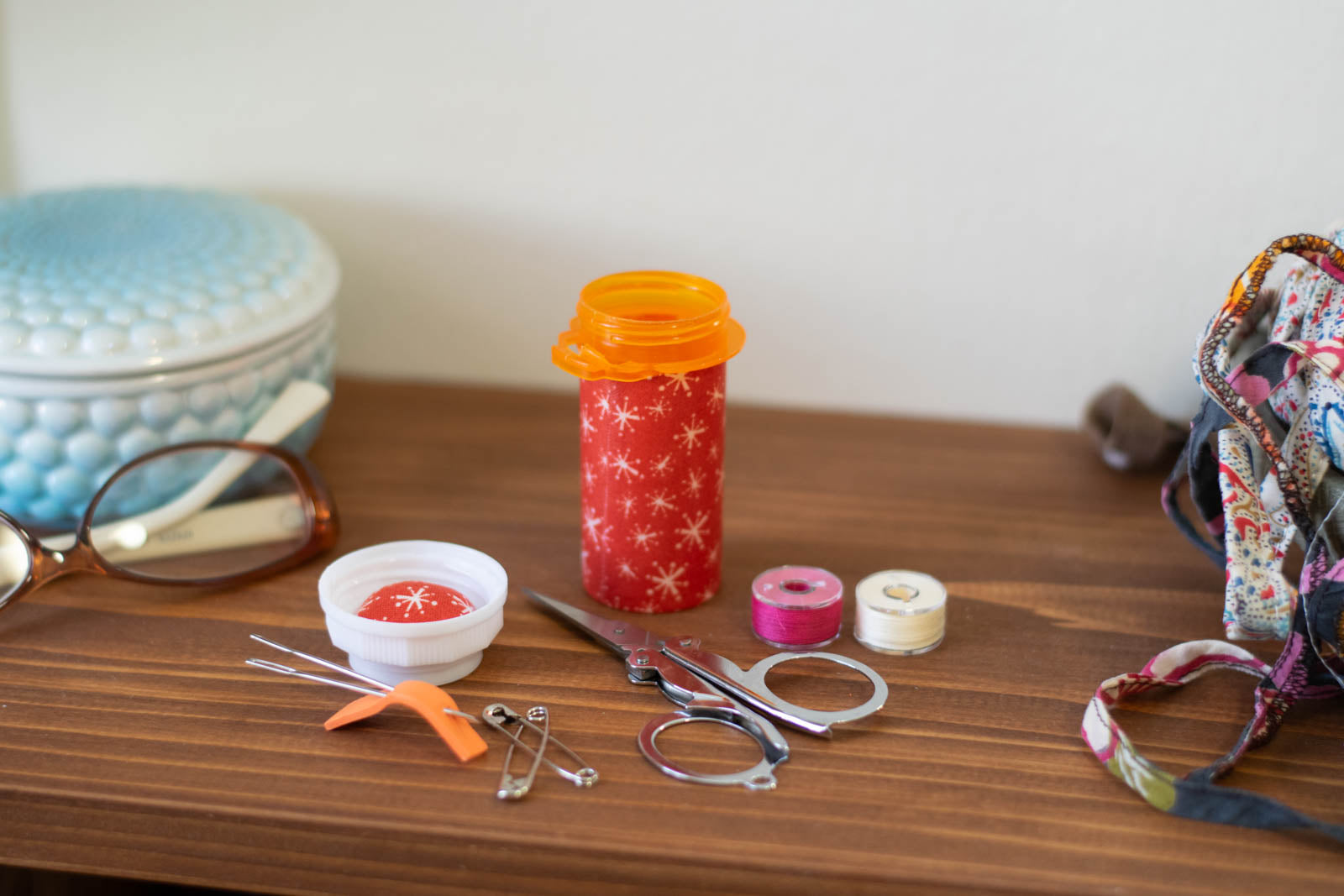 upcycled prescription bottle sewing kit — white sparkles on red, 3.25" high, open with contents