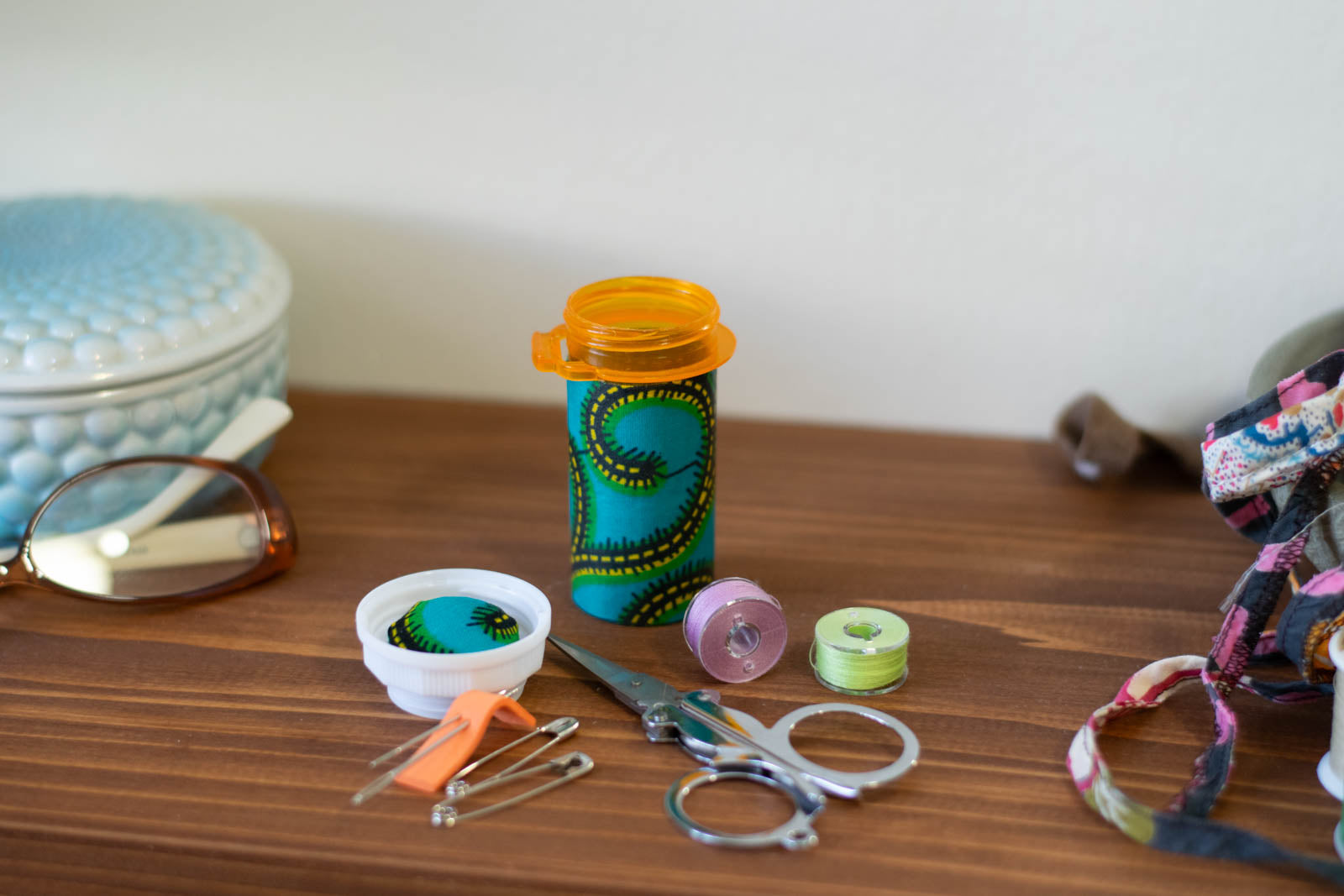 Upcycled Prescription Bottle Sewing Kit — Teal African Wax Print, 3.25" high, open with contents