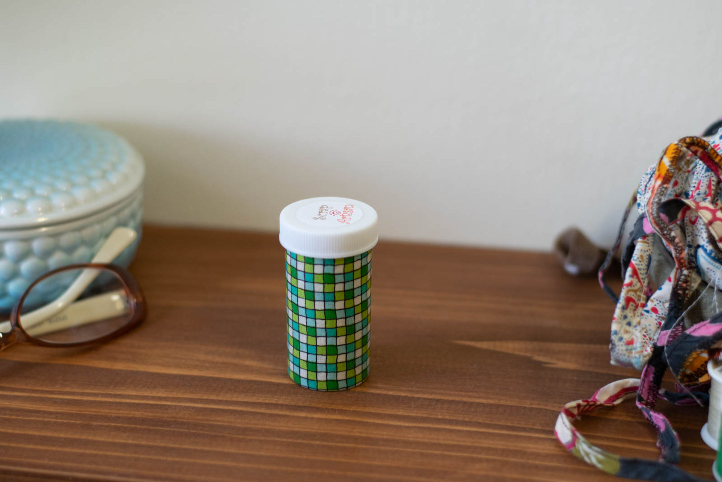 upcycled prescription bottle sewing kit — green tiles, 2.75" high, child proof lid, closed