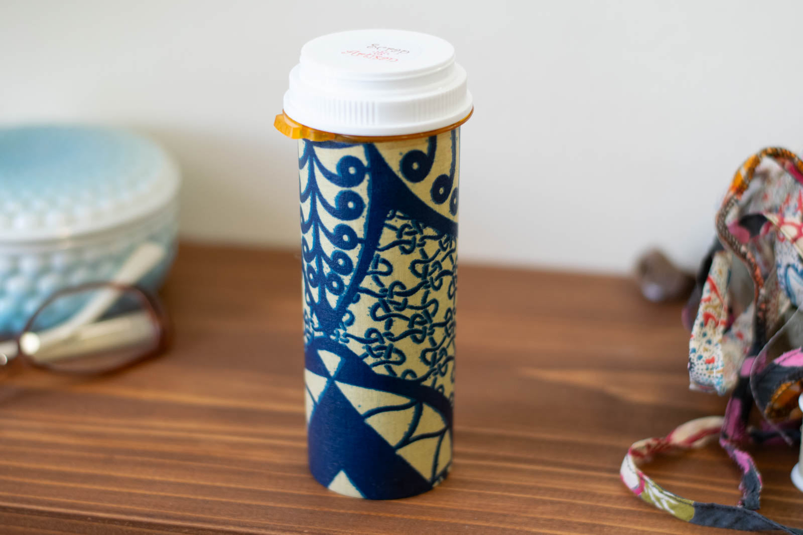 upcyclced prescription bottle sewing kit — blue African wax print, 5.75" high, closed