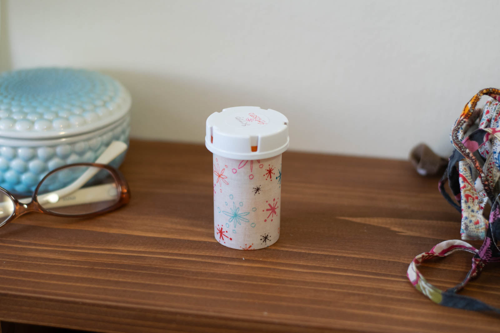 upcycled prescription bottle sewing kit — multi color sparkles on white, 3" high, closed