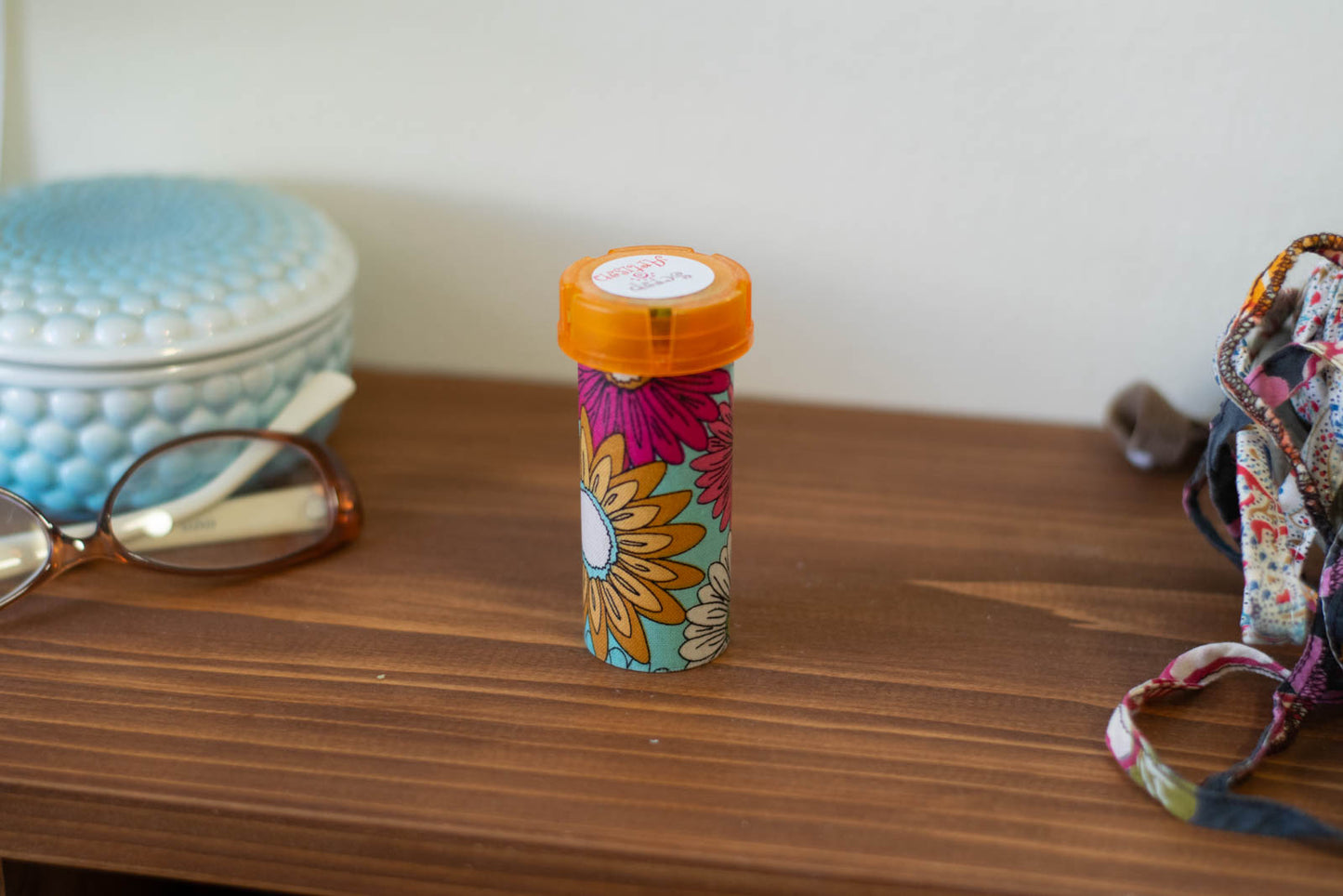 Upcycled Prescription Bottle Sewing Kit — Pink, Ochre and White Flowers on Light Blue, 3.5" high, closed