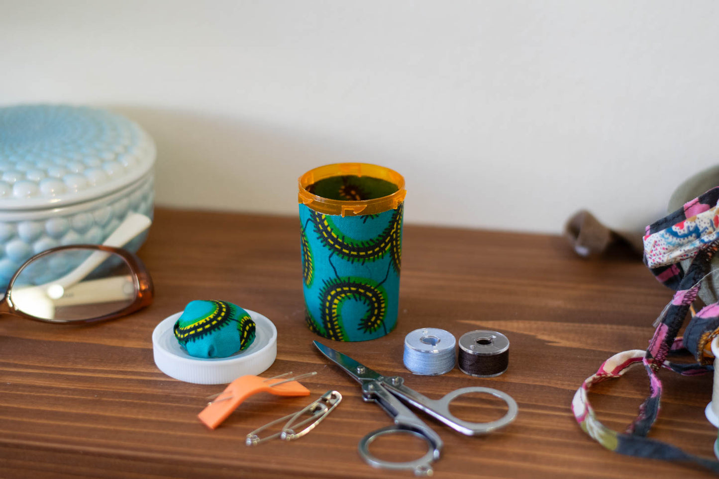 Upcycled Prescription Bottle Sewing Kit — Teal African Wax Print, 2.75" high, open with contents